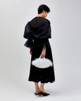 Load image into Gallery viewer, woman holding nest feather handbag in white
