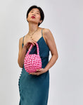 Load image into Gallery viewer, woman wearing Hive handbag in bubblegum
