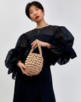 Load image into Gallery viewer, woman wearing Hive handbag in champagne
