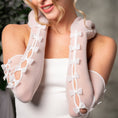 Load image into Gallery viewer, White sheer gloves with bow details worn by a person, against a neutral background
