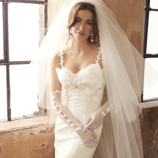 bride wearing Cornelia James bridal gloves