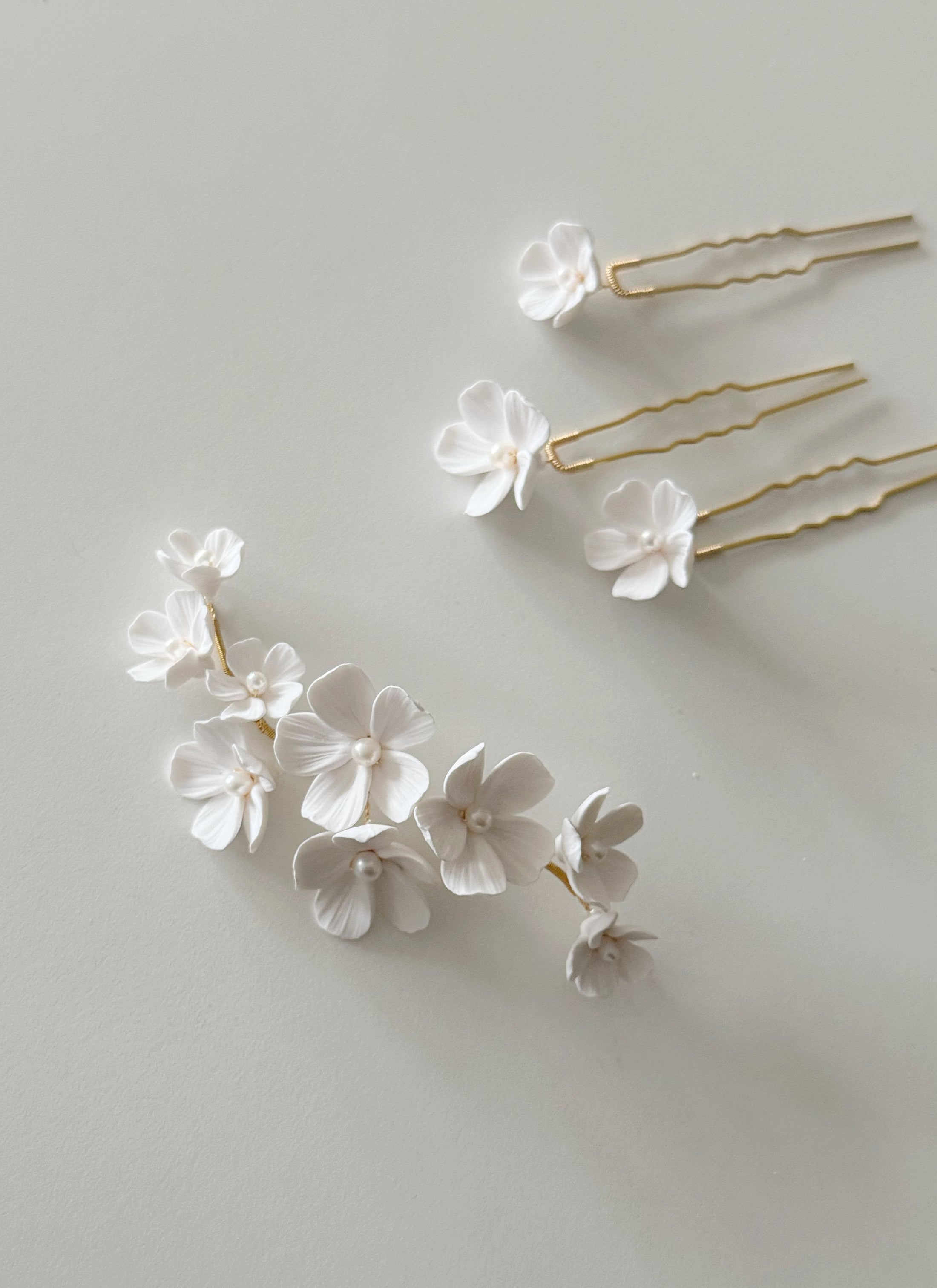 Floral hairpins on a light gray background
