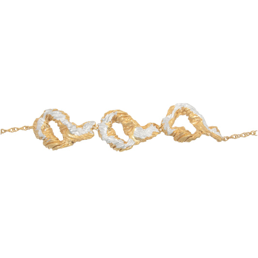Gold and silver braided bracelet on a white background