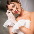 Load image into Gallery viewer, Woman wearing a white off-shoulder dress and gloves against a neutral background
