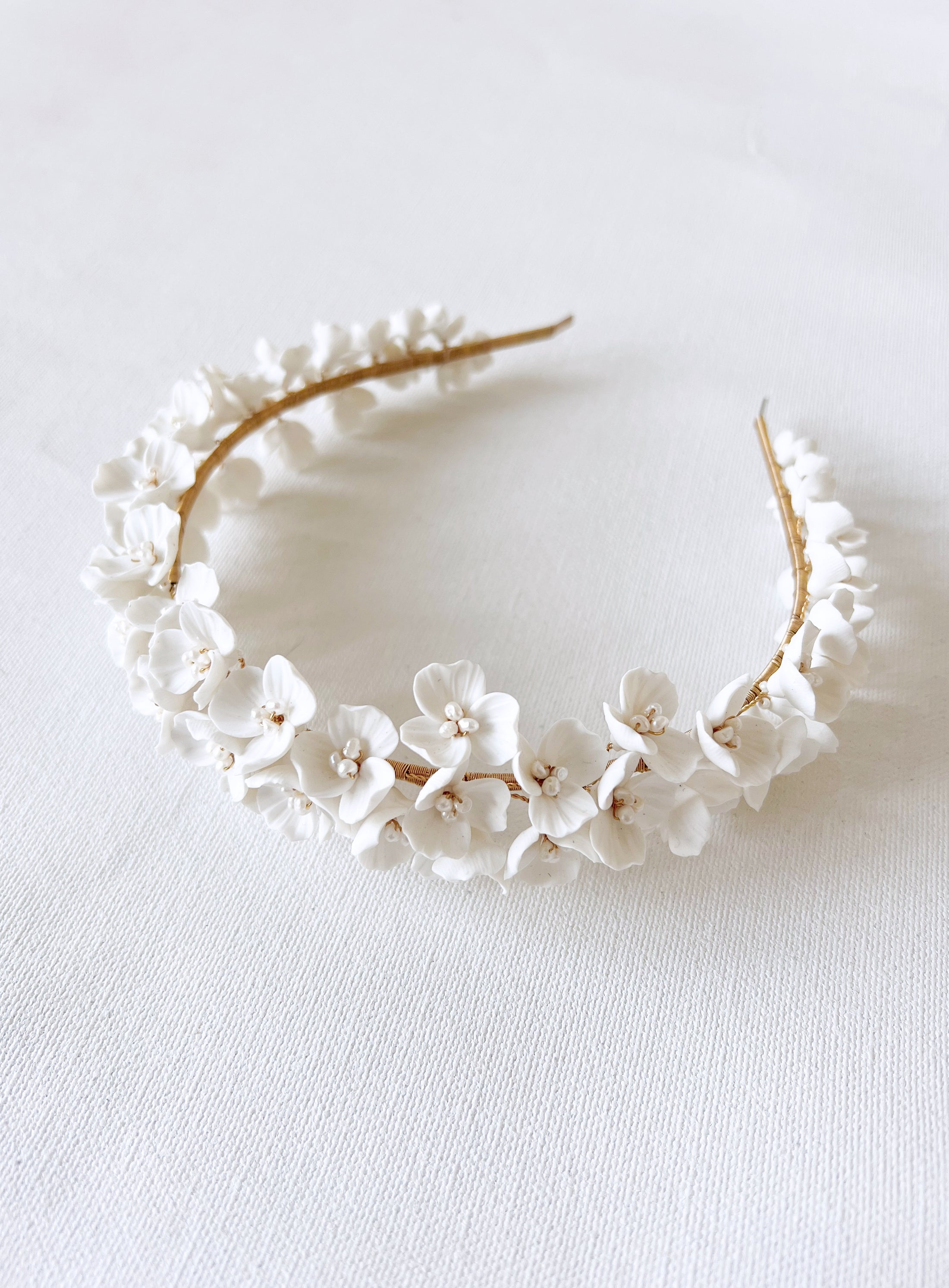 Floral headband with white flowers on a light background