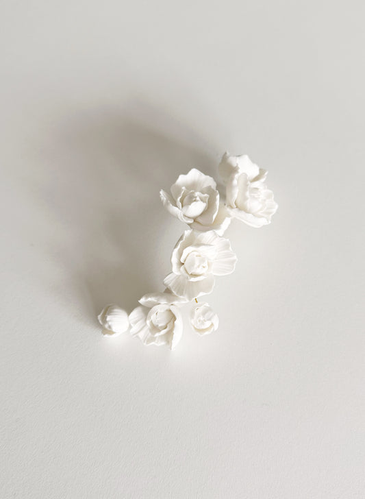 Decorative number '2' made of white flowers on a light gray background