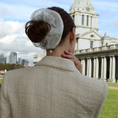 Load image into Gallery viewer, Person wearing a white lace bridal headband in an urban setting with a building and sky in the background
