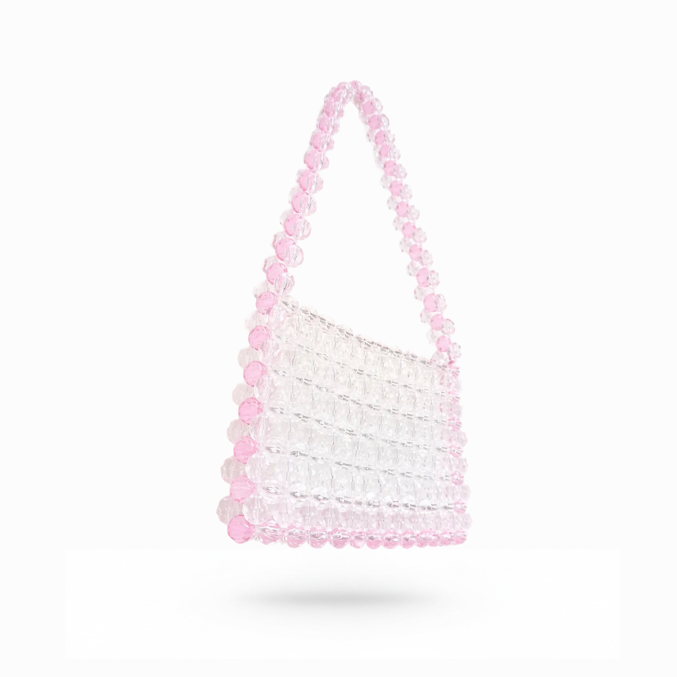 White bridal bag with pink beaded handle on a white background