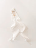 Load image into Gallery viewer, White satin ribbon with gold hair clips on a white background

