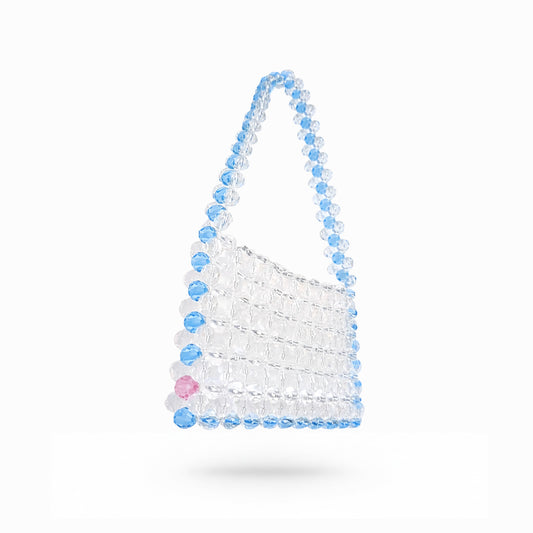 Beaded bridal bag with blue and clear beads on a white background