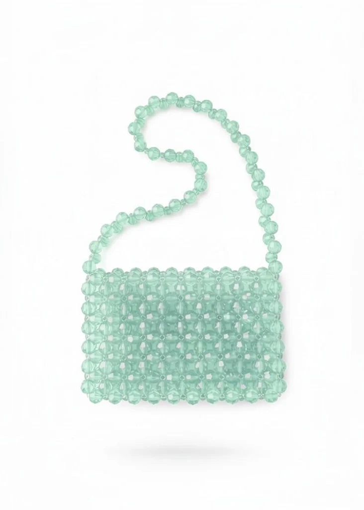 Mint green beaded bridal handbag on a white background