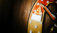 Load image into Gallery viewer, Decorative arch with lights and a letter 'A' on a wooden background and a bridal bag
