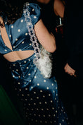 Load image into Gallery viewer, woman wearing a navy polkadot dress wearing a bridal bag
