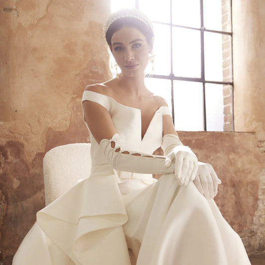 bride wearing Cornelia James bridal opera gloves