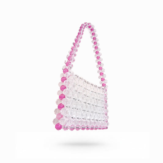 Beaded bridal bag with pink and clear beads on a white background