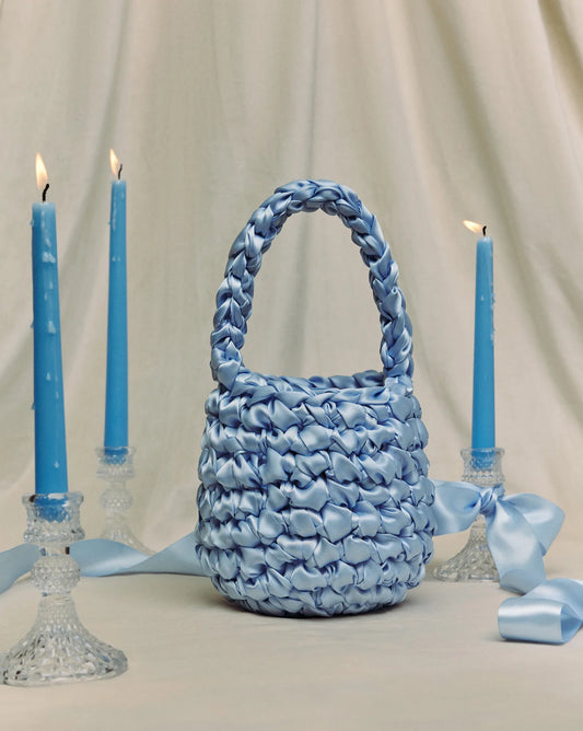hive bridal handbag in bluebell with blue candlesticks