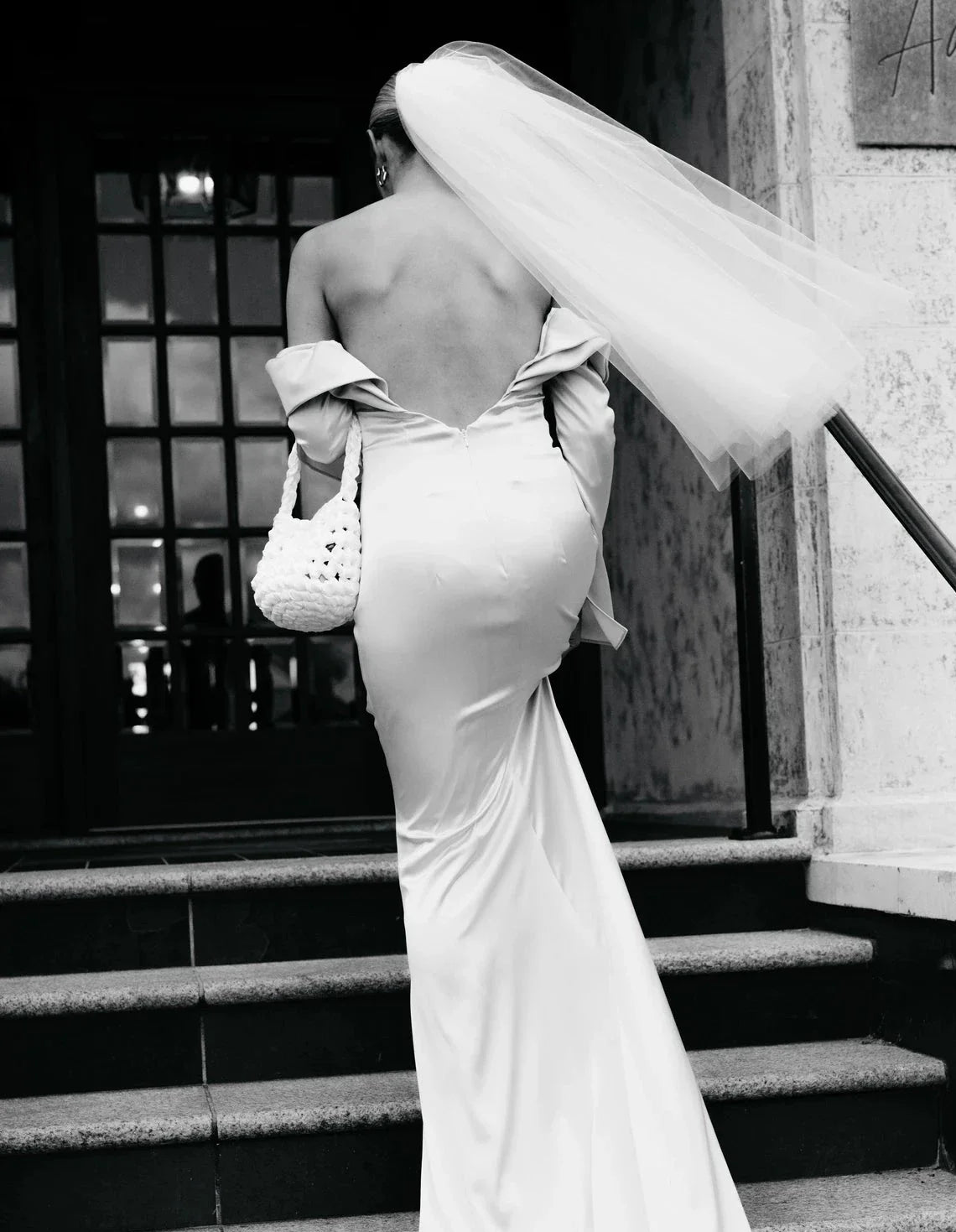 bride wearing Hive bridal handbag in bright white