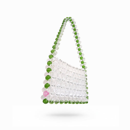 Beaded bridal bag with green and clear beads on a white background