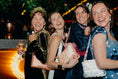 Load image into Gallery viewer, Four women laughing together at a social event with festive decorations wearing bridal bag
