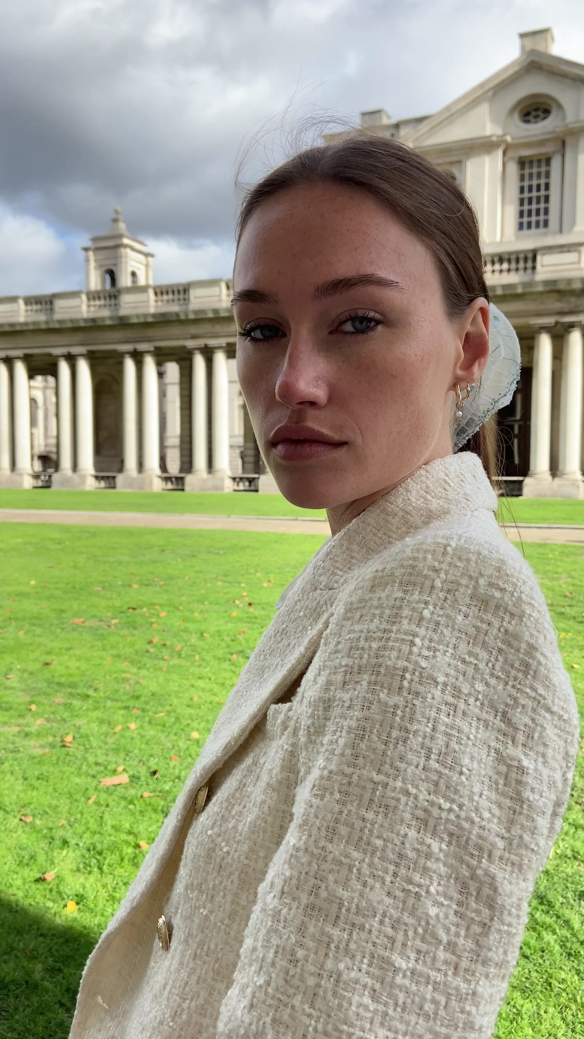 woman in outdoor setting wearing a white bridal hair scrunchie
