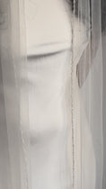 Load and play video in Gallery viewer, Person wearing a white wedding dress with a long pearl veil against a plain background
