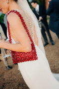Load image into Gallery viewer, Person wearing a beaded dress and beaded bridal bag with a blurred background
